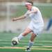 Skyline's Carmen Flesher kids the ball up field during the first half of their game against Huron, Thursday May 23.
Courtney Sacco I AnnArbor.com 